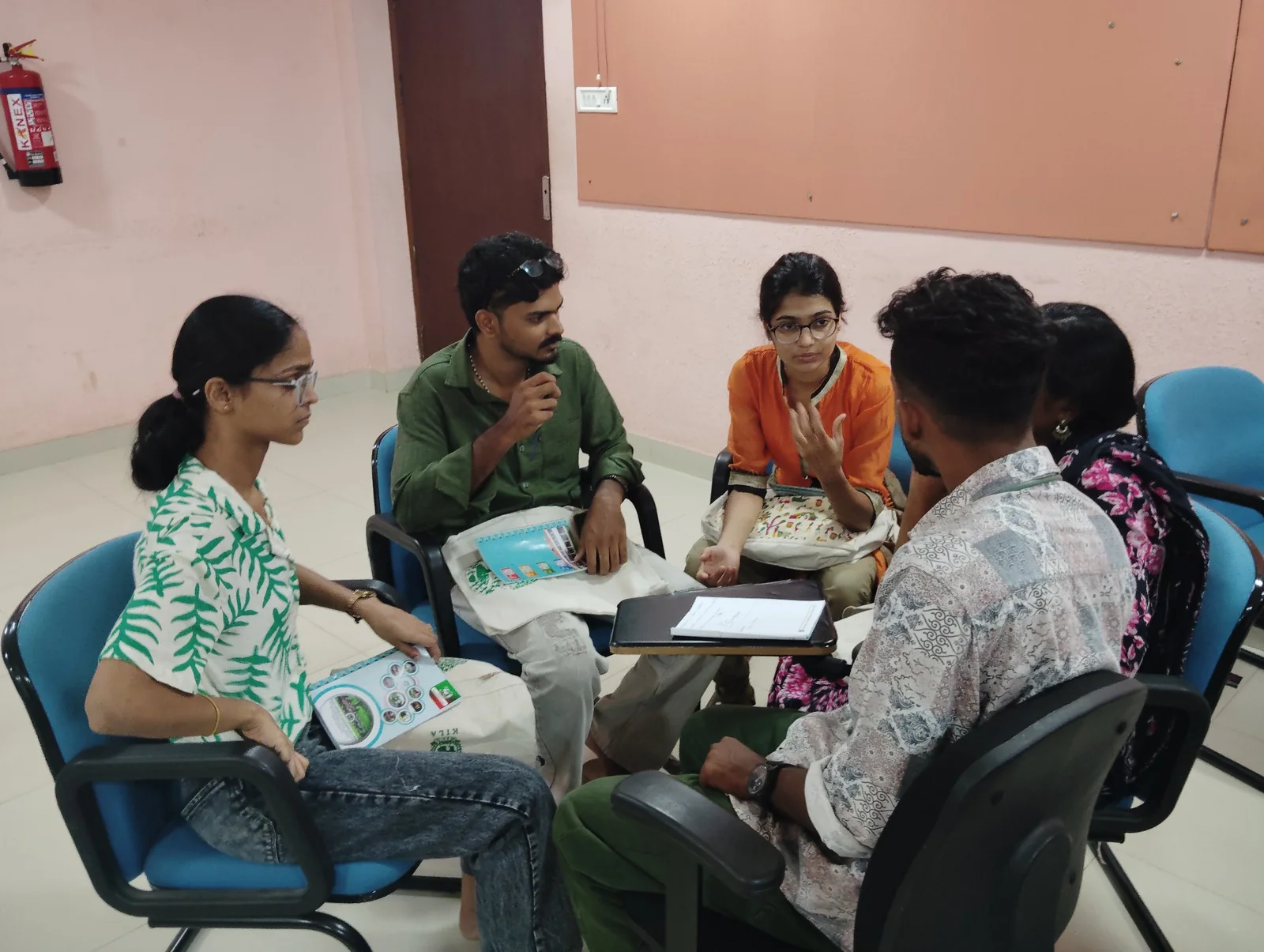 Participants sitting together in a small-group discussion